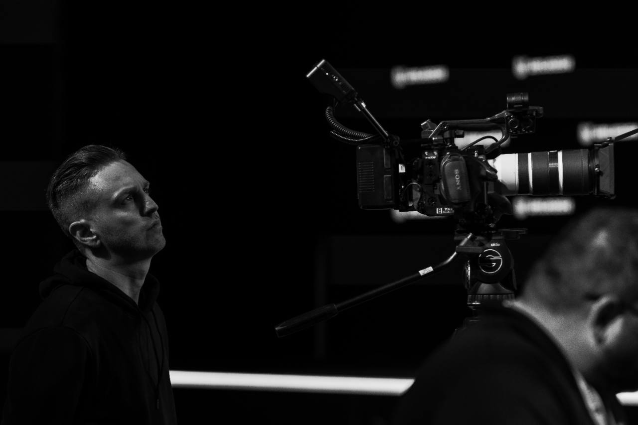 Jordan beside a production camera