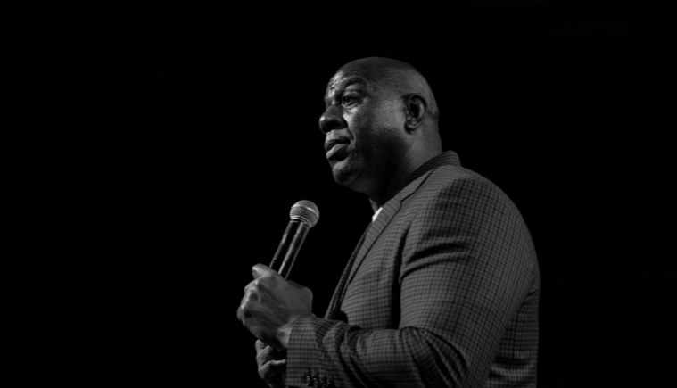 Speaker holding a microphone