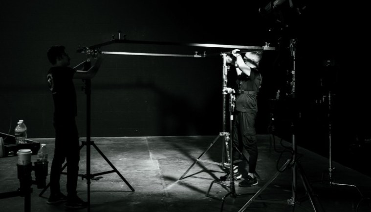 Production crew in a studio setup