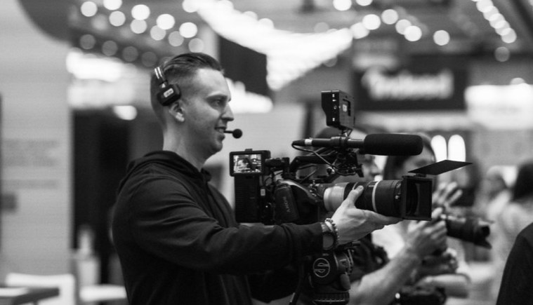 Camera operator on a show floor