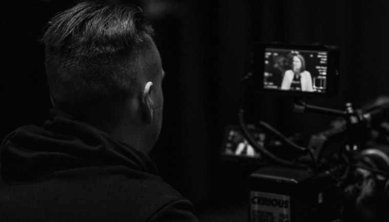 Operator monitoring a filmed interview