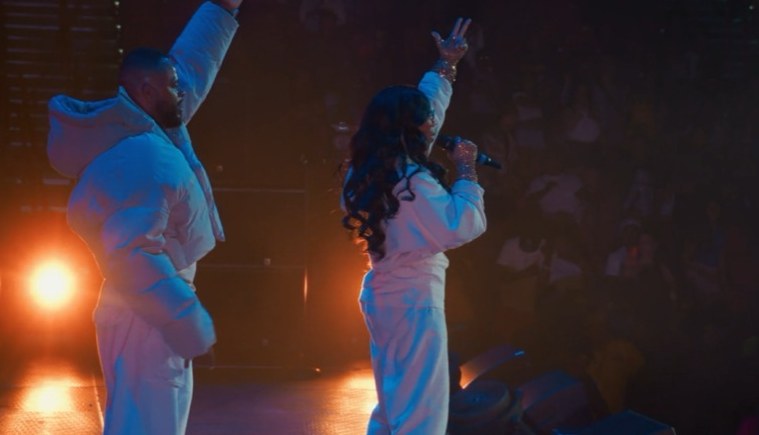 Performers under stage lights