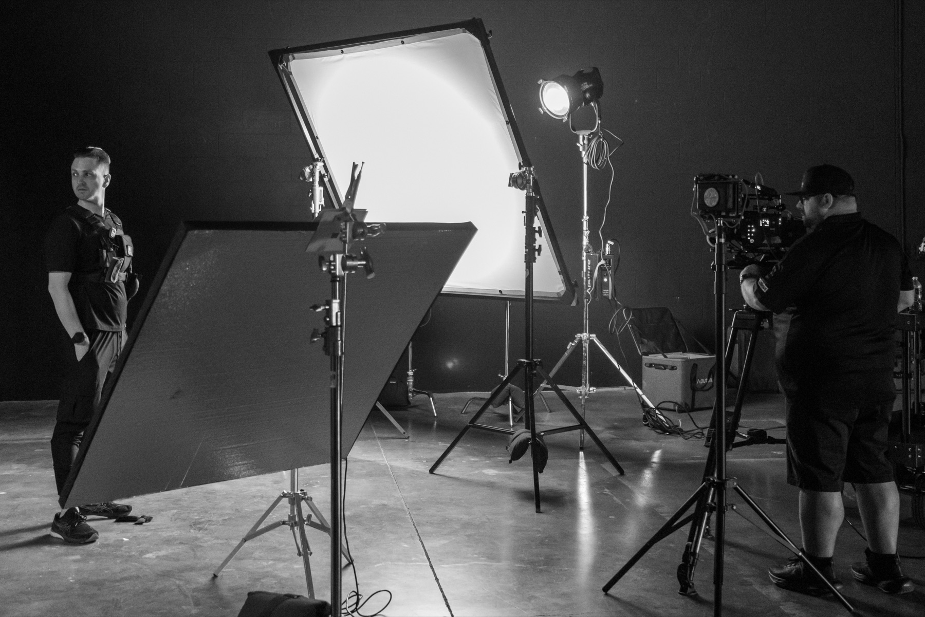 Production crew around lighting and camera setup