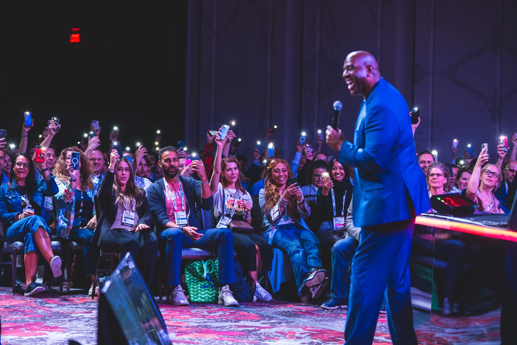 Speaker on stage in front of a live audience